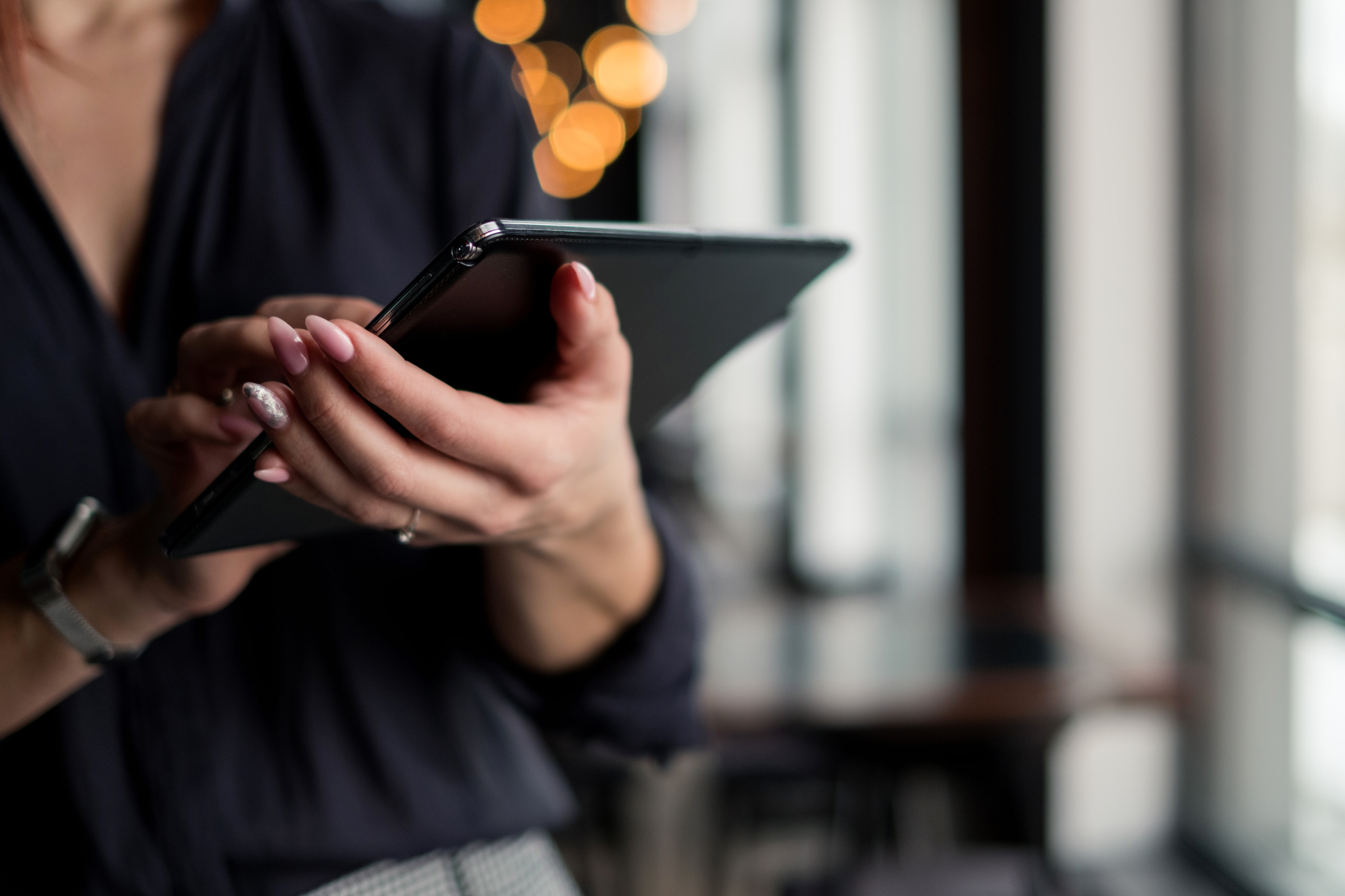 Stylish female blogger using tablet